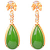 Pair of gold-tone drop earrings with green teardrop stones and clear beads