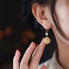 Bodhi Seed Cat Paw Earrings with Gold-Tone Hook