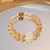 Double strand citrine and tiger eye bracelet with carved Zakiram charm