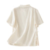 Back view of a white women's cotton linen short sleeve shirt with side frog buttons
