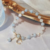 Crystal and Cat's Eye Charm Bracelet with Star, Moon and Flower Beads