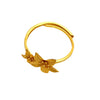Close up of a gold-tone adjustable copper ring with a small flower detail