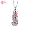 Silver dragon wrapped around a pink rose quartz cylinder pendant on a chain