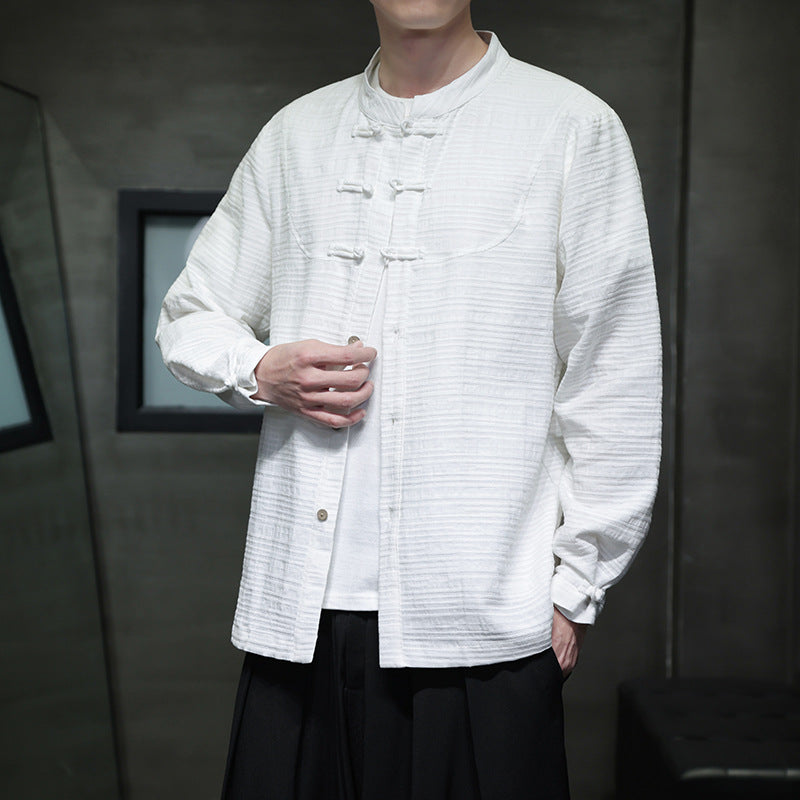 Man wearing a white long-sleeve cotton linen shirt with traditional knot buttons
