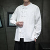 Man wearing a white long-sleeve cotton linen shirt with traditional knot buttons