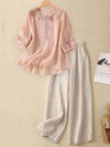 Pink embroidered cotton linen top paired with beige wide leg pants