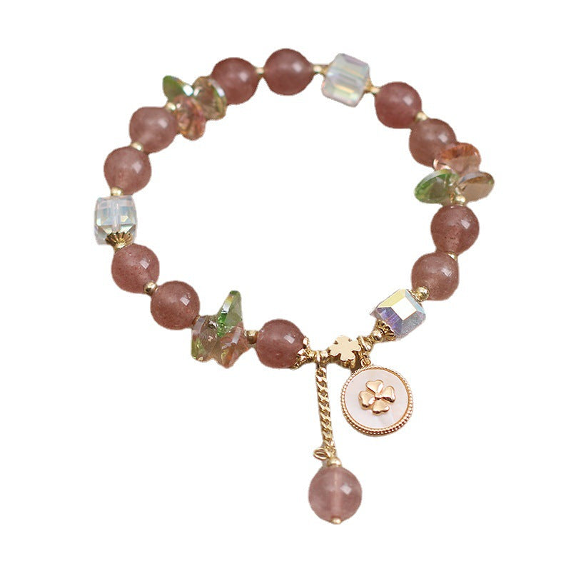 Pink Strawberry Quartz beaded bracelet with a gold-tone four leaf clover charm