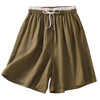 Olive green wide leg linen shorts with white drawstring waist