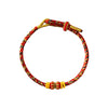 Close up of a red and gold braided rope bracelet with small beads
