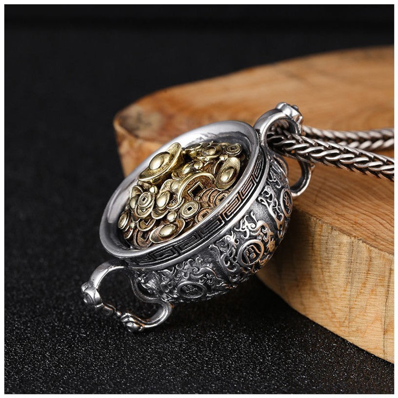 Silver-tone treasure bowl pendant filled with gold coins on a rope chain