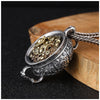 Silver-tone treasure bowl pendant filled with gold coins on a rope chain