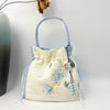 Embroidered Drawstring Bucket Bag with Tassel, Floral and Animal Motifs