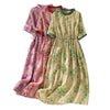Three floral print cotton midi dresses in red, pink, and green with drawstring waists