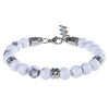 Close up of a white howlite beaded bracelet with silver metal spacers and a clasp