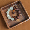 Wood Bead Bracelet with Engraved Charms and Tassel