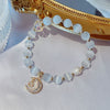 Crystal and Cat's Eye Charm Bracelet with Star, Moon and Flower Beads