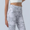 Side view of a woman wearing high waist floral print yoga leggings