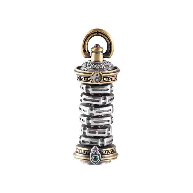 Close-up of a rotatable copper tower pendant held in hand showing detailed engravings