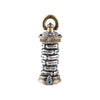 Close-up of a rotatable copper tower pendant held in hand showing detailed engravings