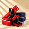 Stack of red, blue and white lighted jewelry boxes with gold edges