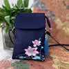Navy blue nylon crossbody bag with pink lotus flower embroidery and blue tassel