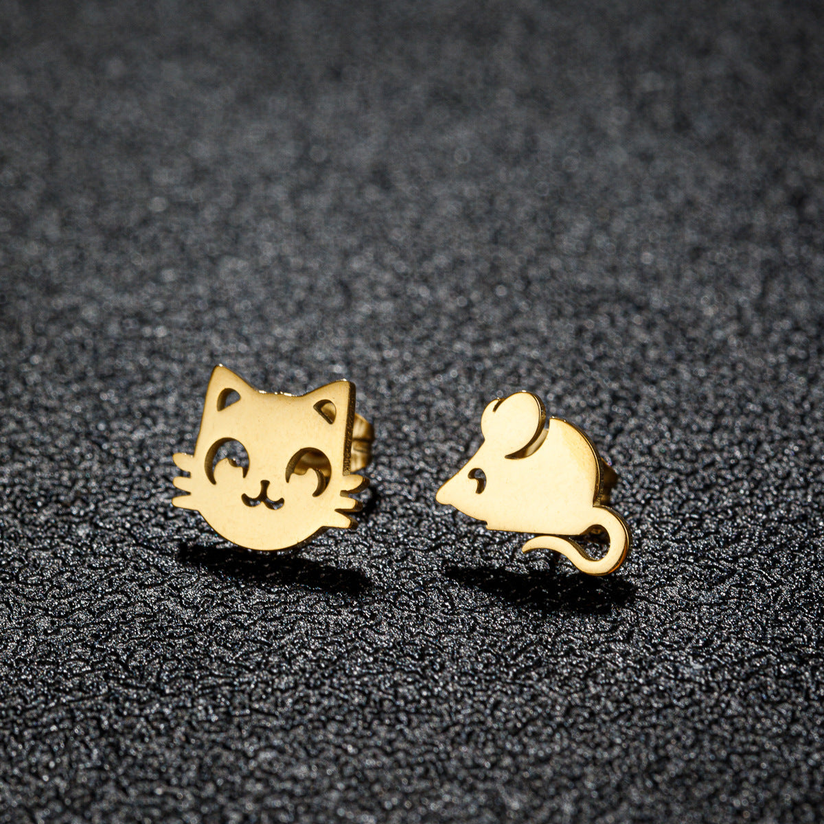 Small stainless steel stud earrings in various shapes like cats, mice, and flowers.
