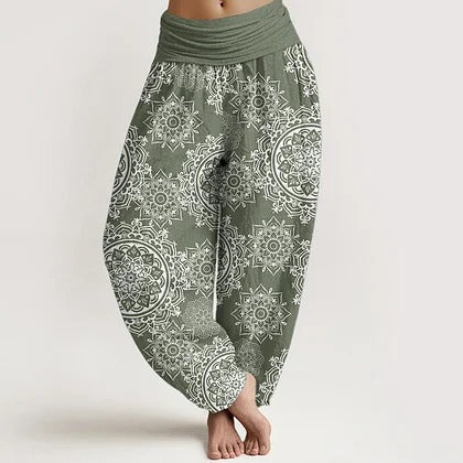 Model wearing green floral print harem pants with elastic waist