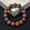 Wood Bead Bracelet with Engraved Charms and Tassel