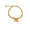 Gold-tone beaded bracelet with Ji and Fu charms resting on white display stones