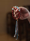 Cinnabar Bracelet with Tassel and Peace Buckle Charm