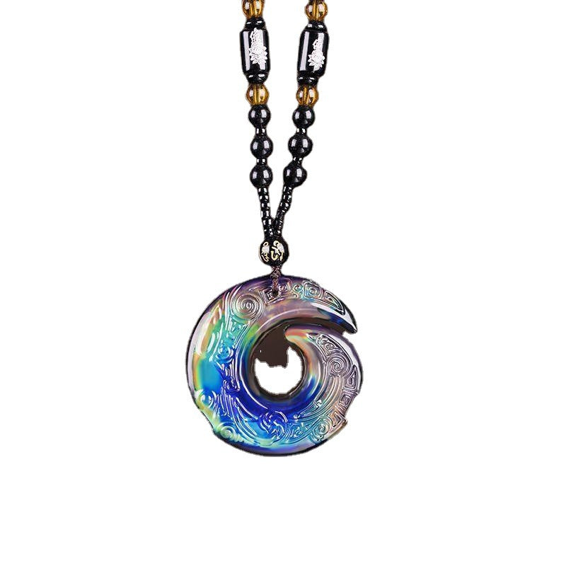Close-up of a multi-colored glass pendant with a swirling cloud pattern on a necklace.