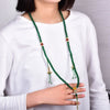 Green agate 108 bead mala necklace worn by a woman in a white shirt
