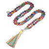 Long beaded necklace with multicolored stones and a tree of life pendant