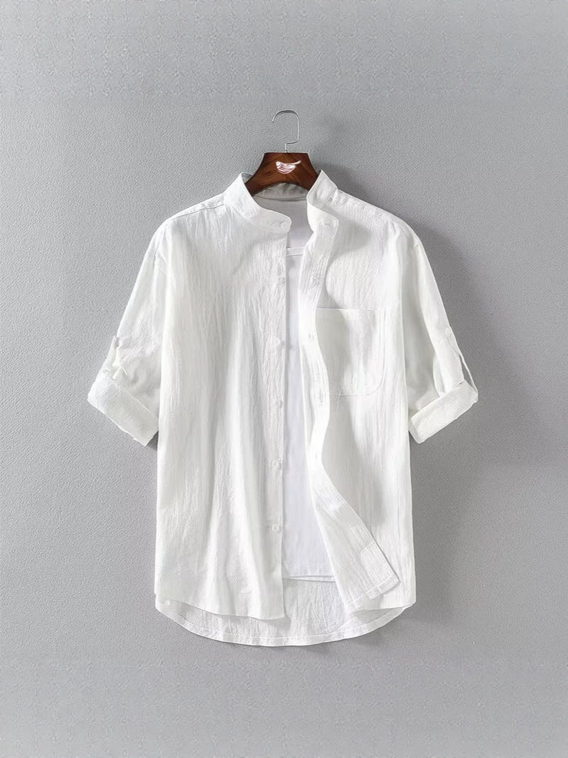 White men's linen-blend shirt with stand collar hanging on a wooden hanger