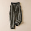 Front view of black and white plaid cotton linen harem pants with elastic waistband