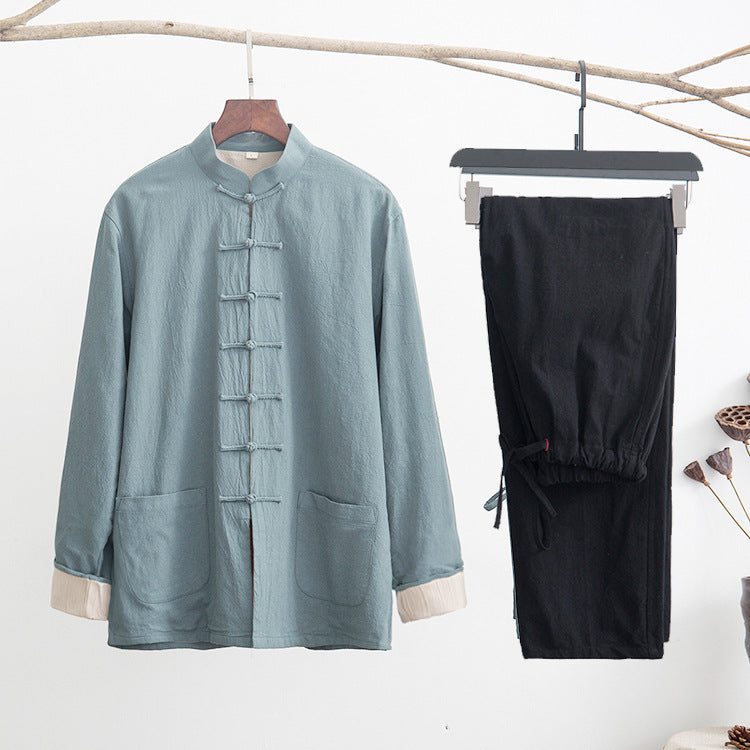 Light blue linen tang suit jacket hanging next to black drawstring pants