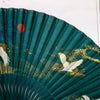 Green bamboo folding fan with white crane and cloud print