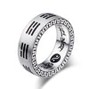 Close up of silver tone titanium steel ring with Chinese characters and Bagua symbols on hand