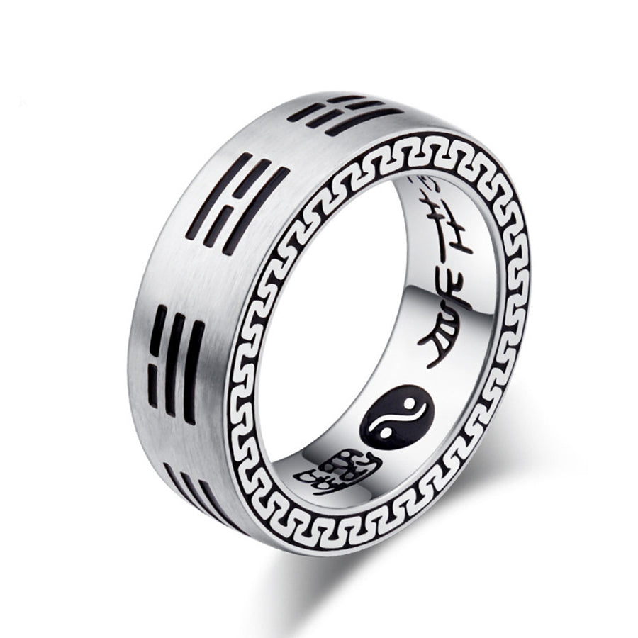 Close up of silver tone titanium steel ring with Chinese characters and Bagua symbols on hand