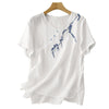 White embroidered cotton linen t-shirt on a hanger