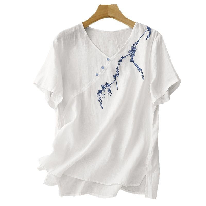 White embroidered cotton linen t-shirt on a hanger