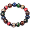A close-up of a colorful Liuli glass bead bracelet on a white background