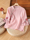 Pink cotton women's shirt with floral embroidery and frog buttons