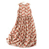 Front view of a white sleeveless midi dress with red floral pattern hanging on a wooden hanger