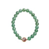 Green strawberry quartz beaded bracelet with gold-tone charm on white surface