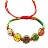 Colorful braided rope bracelet with five gold-tone circular charms depicting the Five Gods of Wealth