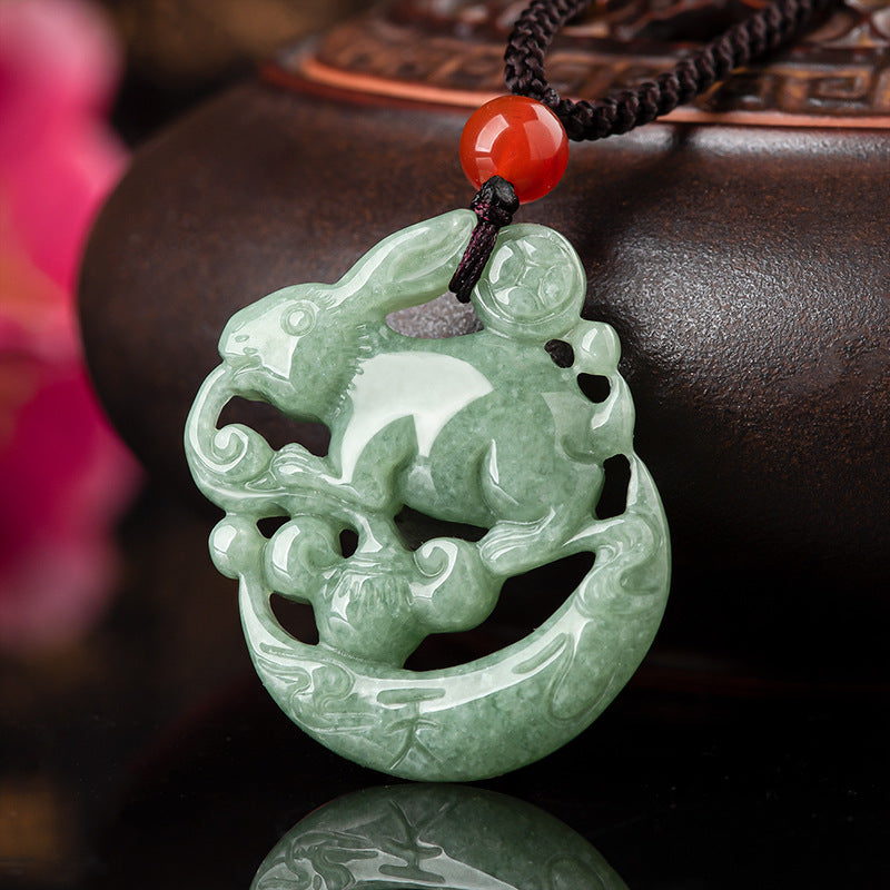 Green jade rabbit pendant carved on a crescent moon shape