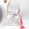 Embroidered Drawstring Bucket Bag with Tassel, Floral and Animal Motifs