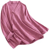 Model wearing a pink long sleeve cotton linen zen shirt with a cross collar
