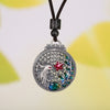 Round 990 silver pendant with a phoenix and flower design on a black cord